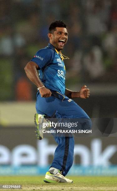 Sri Lanka bowler Seekkuge Prasanna celebrates the wicket of West Indies batsman Lendl Simmons during the ICC World Twenty20 cricket tournament first...