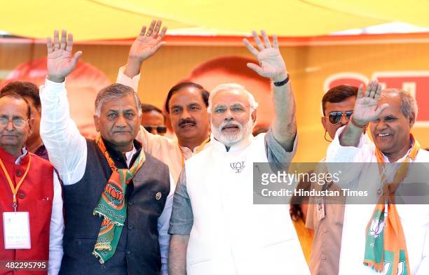 Prime Ministerial candidate Narendra Modi with Ghaziabad candidate and former Indian Army Chief VK Singh, Gautam Budh Nagar candidate Mahesh Sharma...