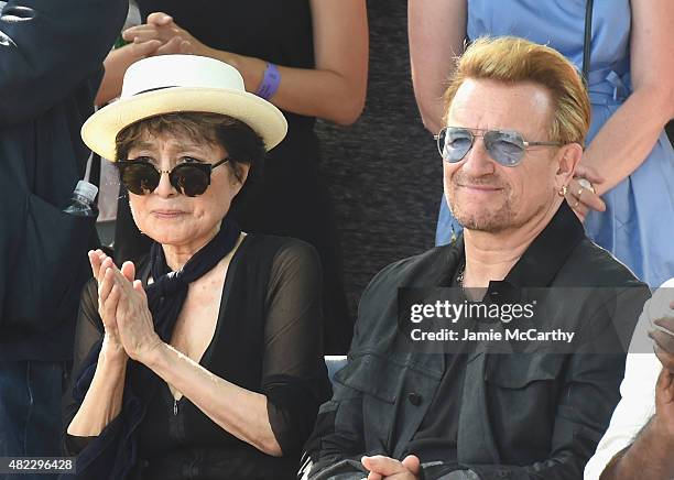 Yoko Ono and Bono attend Amnesty International Tapestry Honoring John Lennon Unveiling at Ellis Island on July 29, 2015 in New York City.
