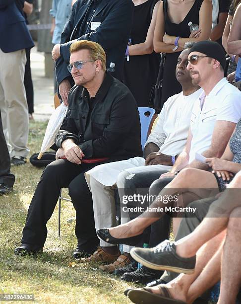 Bono and The Edge of U2 attend Amnesty International Tapestry Honoring John Lennon Unveiling at Ellis Island on July 29, 2015 in New York City.