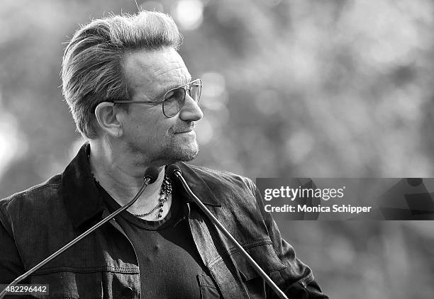 Bono speaks at the Amnesty International Tapestry Honoring John Lennon Unveiling at Ellis Island on July 29, 2015 in New York City.
