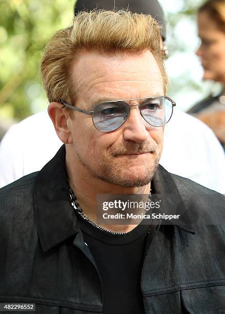 Bono attends the Amnesty International Tapestry Honoring John Lennon Unveiling at Ellis Island on July 29, 2015 in New York City.