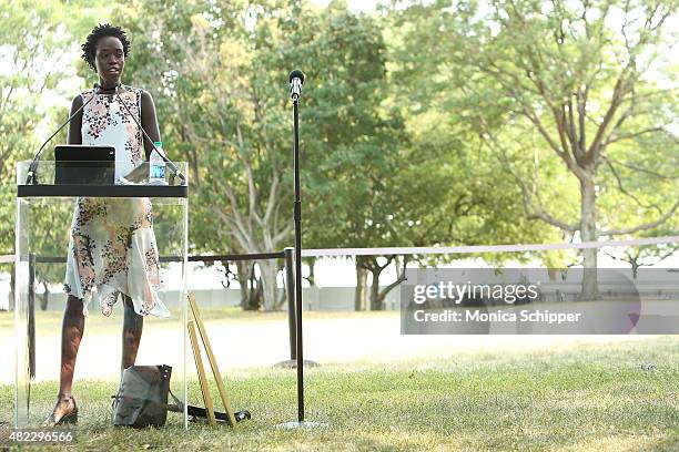 Kuoth Wiel speaks at the Amnesty International Tapestry Honoring John Lennon Unveiling at Ellis Island on July 29, 2015 in New York City.