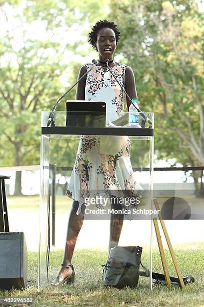 Kuoth Wiel speaks at the Amnesty International Tapestry Honoring John Lennon Unveiling at Ellis Island on July 29, 2015 in New York City.