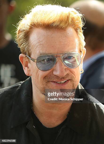 Bono attends the Amnesty International Tapestry Honoring John Lennon Unveiling at Ellis Island on July 29, 2015 in New York City.