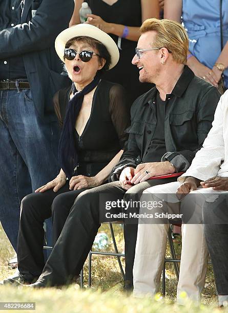 Yoko Ono and Bono attend the Amnesty International Tapestry Honoring John Lennon Unveiling at Ellis Island on July 29, 2015 in New York City.