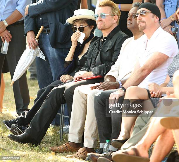 Yoko Ono, Bono, Salil Shetty and The Edge attend the Amnesty International Tapestry Honoring John Lennon Unveiling at Ellis Island on July 29, 2015...