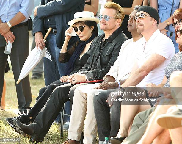 Yoko Ono, Bono, Salil Shetty and The Edge attend the Amnesty International Tapestry Honoring John Lennon Unveiling at Ellis Island on July 29, 2015...