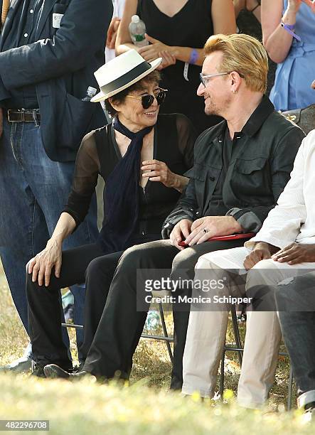 Yoko Ono and Bono attend the Amnesty International Tapestry Honoring John Lennon Unveiling at Ellis Island on July 29, 2015 in New York City.