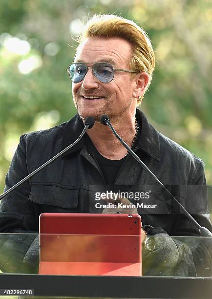 Bono speaks at Amnesty International Tapestry Honoring John Lennon Unveiling at Ellis Island on July 29, 2015 in New York City.