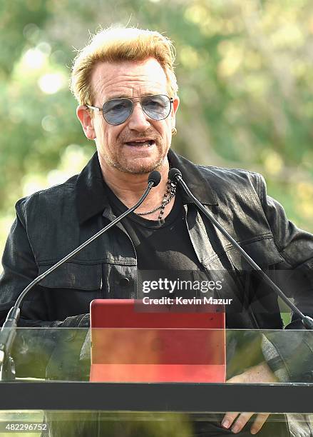 Bono speaks at Amnesty International Tapestry Honoring John Lennon Unveiling at Ellis Island on July 29, 2015 in New York City.