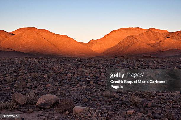 Sunset over the hammmada desert landscape.