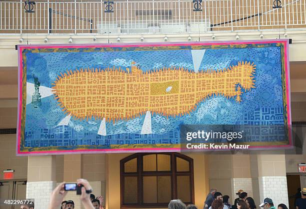 Amnesty International Tapestry Honoring John Lennon Unveiling at Ellis Island on July 29, 2015 in New York City.
