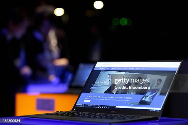 Laptop computer running Microsoft Corp.'s Windows 10 operating system sits on display during a launch event in Tokyo, Japan, on Wednesday, July 29,...