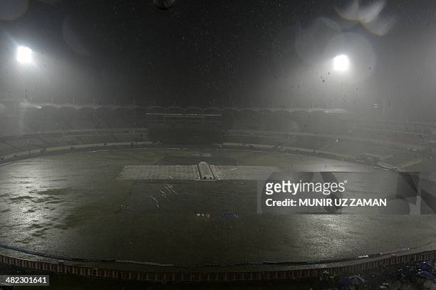 General view of the stadium as heavy rain falls during the ICC World Twenty20 cricket tournament first semi-final match between Sri Lanka and West...