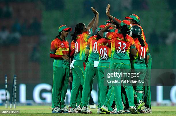 Rumana Ahmed of Bangladesh celebrates the wicket of Mary Waldron of Ireland during the ICC Women's World Twenty20 9th/10th Ranking match between...