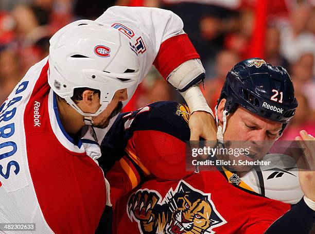 Krys Barch of the Florida Panthers fights with George Parros of the Montreal Canadiens at the BB&T Center on March 29, 2014 in Sunrise, Florida.