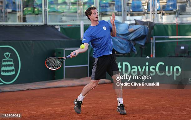 Andy Murray of Great Britain plays a forehand during a late practice session prior to the Davis Cup World Group Quarter Final match between Italy and...