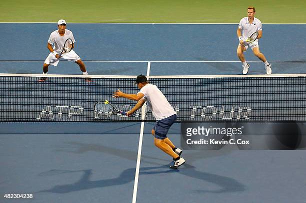 Andy Roddick returns a backhand to Yen-Hsun Lu of Chinese Taipei and Jonathan Marray of Great Britain during the BB&T Atlanta Open at Atlantic...