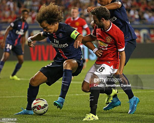 Moreira Marinho of Paris Saint-Germain holds off Juan Mata of Manchester United during a match in the 2015 International Champions Cup at Soldier...