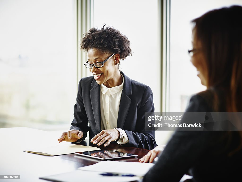 Two businesswomen having project meeting