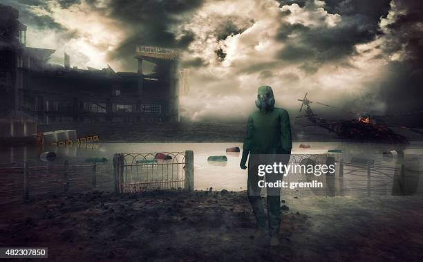 man in hazmat suit walking in destroyed environment - habitat destruction stock pictures, royalty-free photos & images