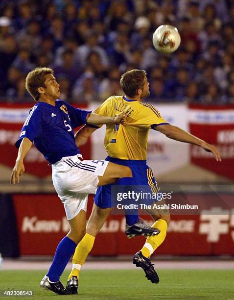 Junichi Inamoto of Japan and Johan Mjallby of Sweden compete for the ball during the international friendly match between Japan and Sweden at the...