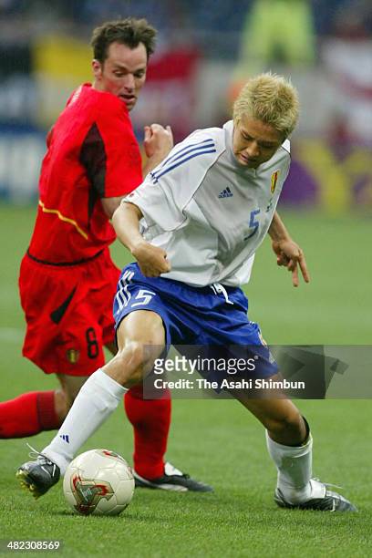 Junichi Inamoto of Japan and Bart Goor of Belgium compete for the ball during the FIFA World Cup Korea/Japan Group H match between Japan and Belgium...