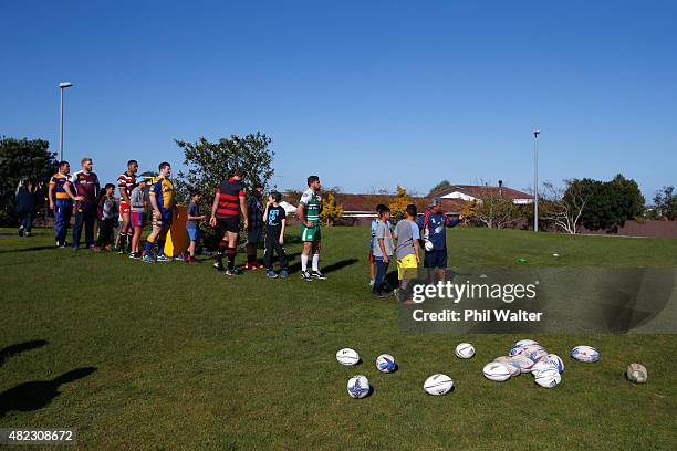 Club captains coach rugby to children at New Windsor School following the 2015 ITM Cup season launch at New Windsor School on July 30, 2015 in...