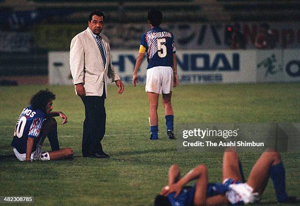 Japan head coach Hans Ooft consoles his players after the 1994 FIFA World Cup Asian Final Qualifier match between Japan and Iraq at Al-Ahly Stadium...