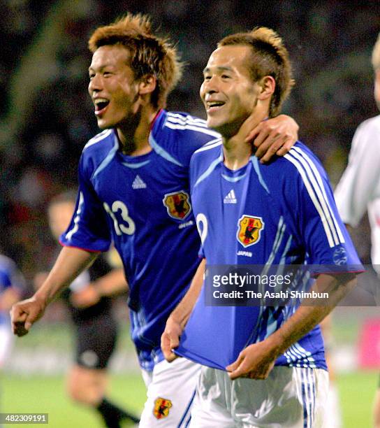 Naohiro Takahara of Japan celebrates scoring his team's first goal with his teammate Atsushi Yanagisawa during the international friendly match...