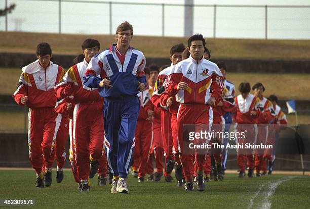Nagoya Grampus Eight new head coach Arsene Wenger and players warm up during the first training of 1995 season at Toyota Sports Center on January 24,...