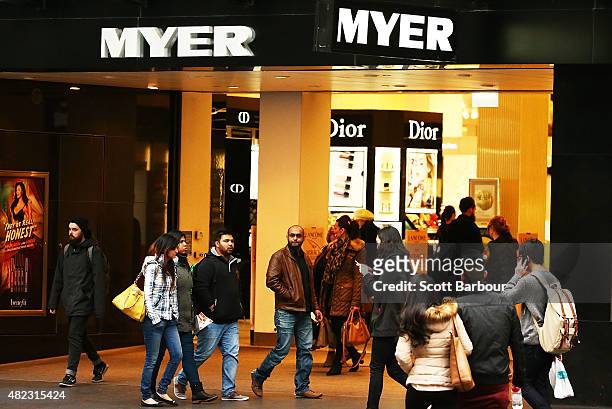 People walk past the Myer Melbourne department store on Bourke Street on July 30, 2015 in Melbourne, Australia. Myer is dropping 100 national and...