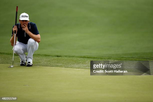 Keegan Bradley of the United States lines up an eagle putt on the eighth green during round one of the Shell Houston Open at the Golf Club of Houston...
