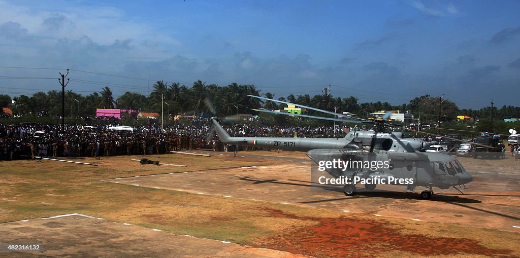 People waiting in a long queue to pay their respects to...