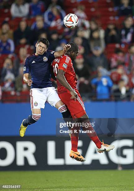 Hendry Thomas of FC Dallas heads the ball against Erick Torres Chivas USA at Toyota Stadium on March 22, 2014 in Frisco, Texas.