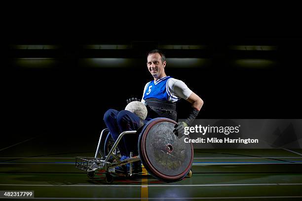 portrait of athlete prepared for wheelchair rugby - wheelchair rugby stock-fotos und bilder