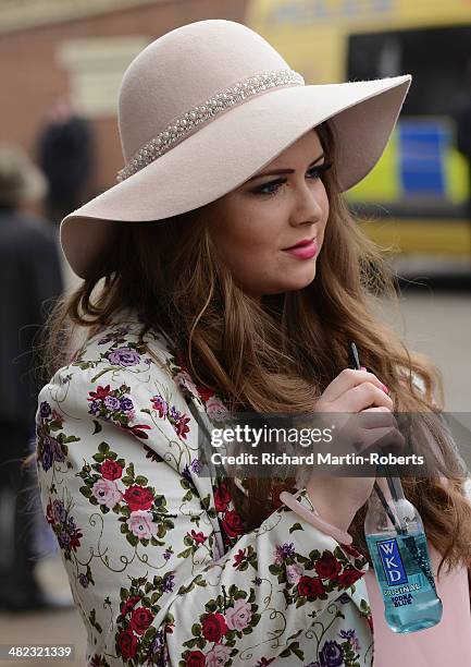 Racegoer looks on during Day 1 of the Aintree races at Aintree Racecourse on April 3, 2014 in Liverpool, England.