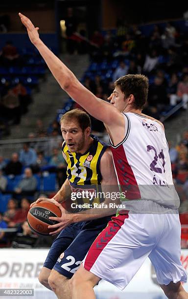 Luka Zoric, #22 of Fenerbahce Ulker Istanbul competes with Tibor Pleiss, #21 of Laboral Kutxa Vitoria during the 2013-2014 Turkish Airlines...