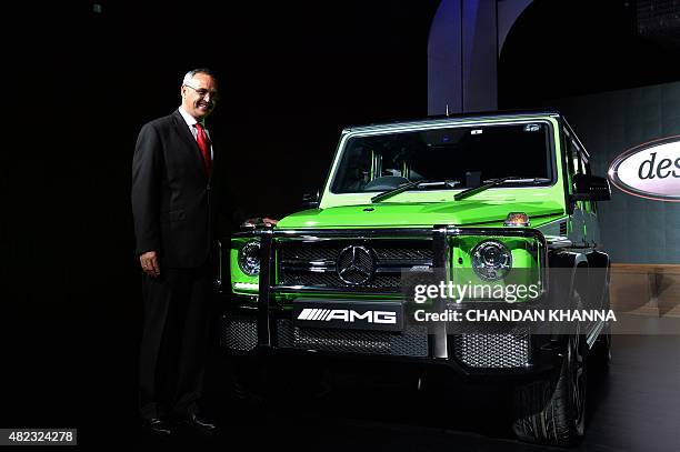 Managing Director and CEO of Mercedes-Benz India, Eberhard Kern, poses alongside a alongside a Mercedes-Benz AMG G 63 'crazy colour' jeep during a...