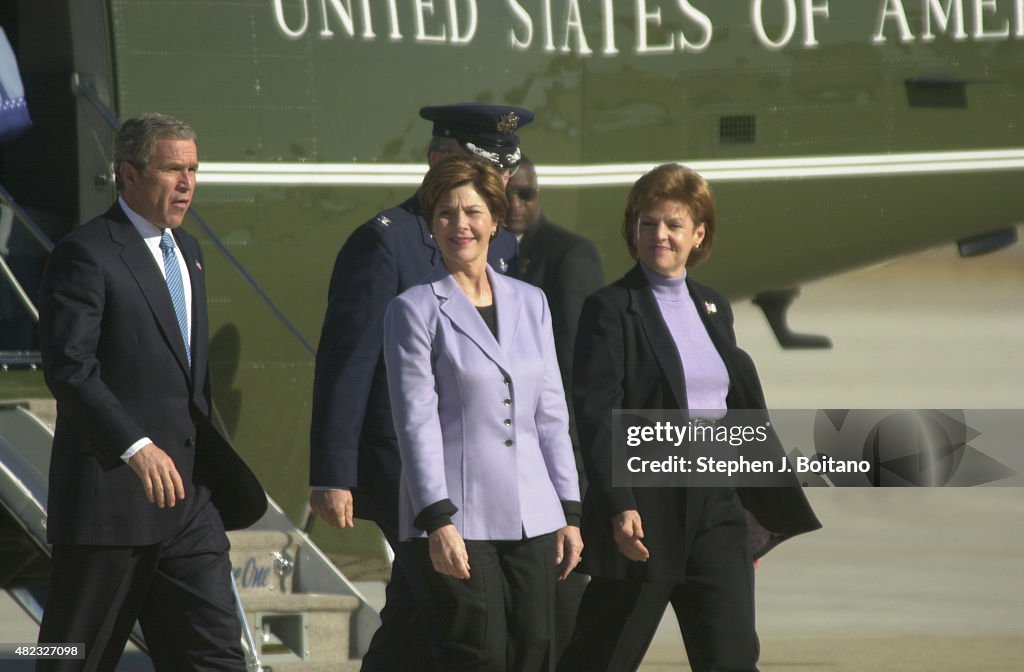 President George W. Bush and wife Laura Bush arrive at...