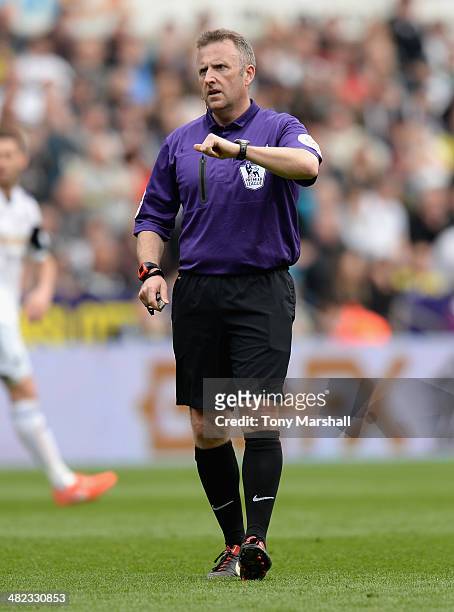 Referee Jonathan Moss during the Barclays Premier League match between Swansea City and Norwich City at Liberty Stadium on March 29, 2014 in Swansea,...