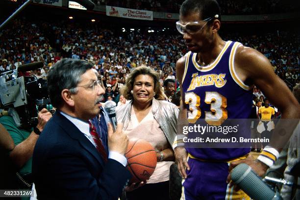 Kareem Abdul-Jabbar of the Los Angeles Lakers is greeted by NBA Commissioner David Stern during a game against the Utah Jazz at the Thomas & Mack...