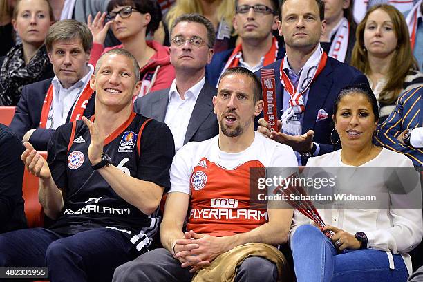 Bastian Schweinsteiger, Frank Ribery and his wife Wahiba attend the the 2013-2014 Turkish Airlines Euroleague Top 16 Date 13 game between FC Bayern...