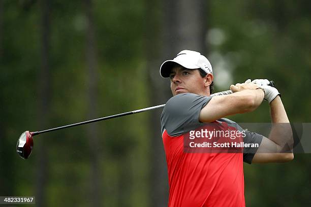 Rory McIlroy of Northern Ireland watches his tee shot on the sixth hole during round one of the Shell Houston Open at the Golf Club of Houston on...