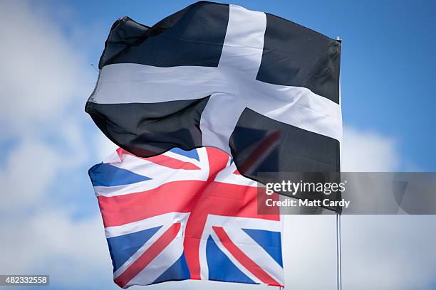 The Cornish flag fly besides a Union Jack at the 2015 Culdrose Air Day at RNAS Culdrose near Helston on July 30, 2015 in Cornwall, England. Air Day...