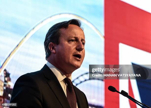 Britain's Prime Minister David Cameron addresses a gathering during a business event at the Symphony Park in Kuala Lumpur on July 30, 2015. Cameron...