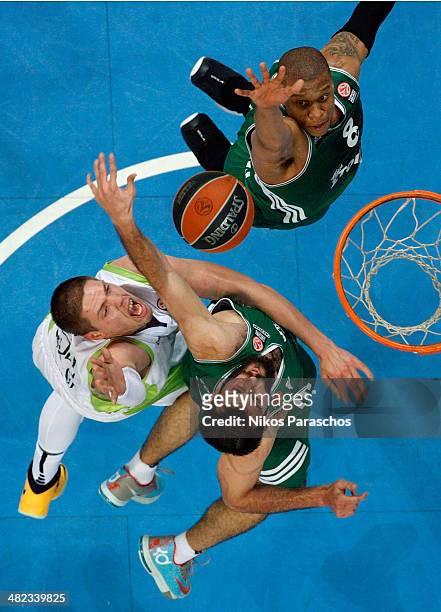 Mike Batiste, #8 of Panathinaikos Athens competes with Vladimir Stimac, #51 of Unicaja Malaga during the 2013-2014 Turkish Airlines Euroleague Top 16...