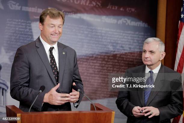 Senators Dean Heller , left, and Jack Reed speak to the press after a 61-35 vote in the Senate to advance the Reed-Heller bill on April 3, 2014 in...