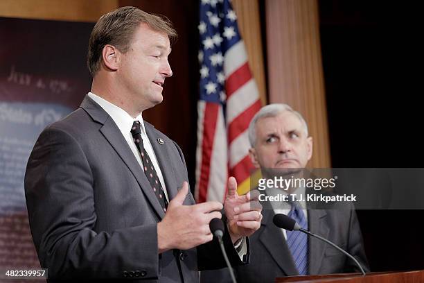 Senators Dean Heller , left, and Jack Reed speak to the press after a 61-35 vote in the Senate to advance the Reed-Heller bill on April 3, 2014 in...